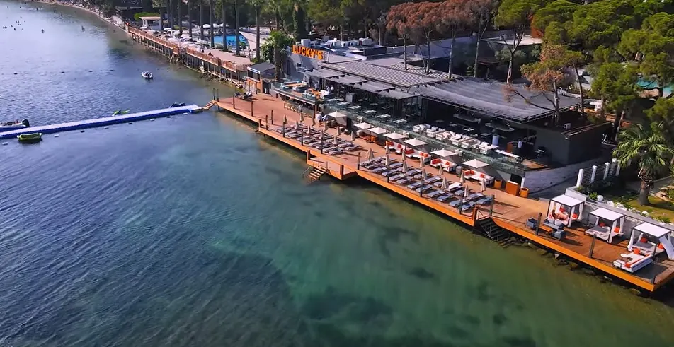Aerial daytime view of a beachfront deck before its lights are switched on